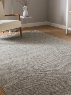 Alfombra artesanal de lana con flecos Lars