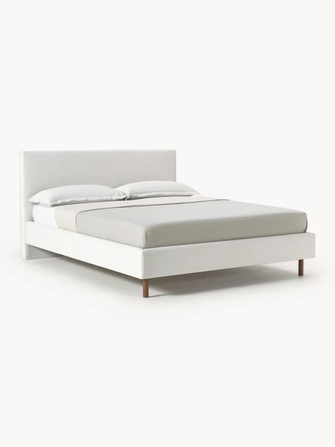 Cama tapizada con patas de madera Giulia