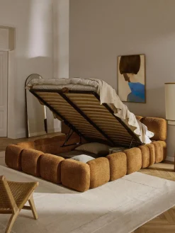 Cama tapizada de boreguillo bouclé con espacio de almacenamiento Tayla