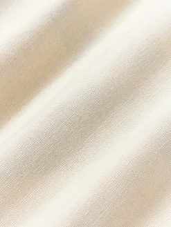 Cojín grande artesanal con motivos geométricos Asta