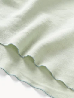 Mantel redondo de lino con ribete Kennedy