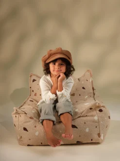 Puf infantil artesanal en tejido bouclé Sugar