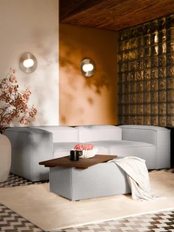 Reposapiés puf en tejido bouclé con espacio de almacenamiento Lennon