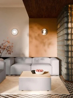 Reposapiés puf en tejido bouclé con espacio de almacenamiento Lennon