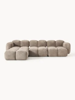 Sofá modular de borreguillo bouclé con reposapiés Tayla (4 plazas)