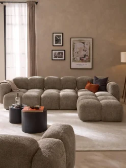 Sofá modular de borreguillo bouclé con reposapiés Tayla (4 plazas)