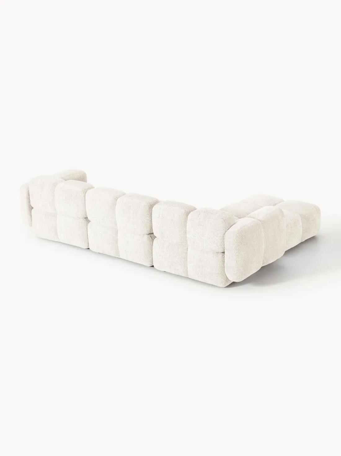 Sofá modular de borreguillo bouclé con reposapiés Tayla (4 plazas)