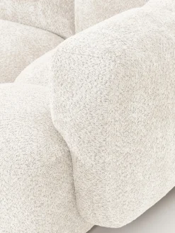 Sofá modular de borreguillo bouclé con reposapiés Tayla (4 plazas)